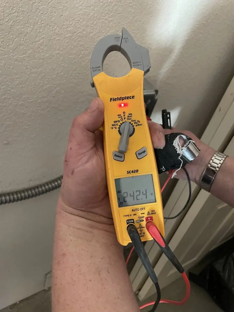 Voltage testing with clamp meter during Whole House Surge Protector in Northfield